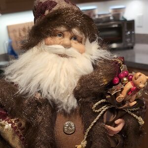 Festive Brown Santa Figurine with Gold Accents